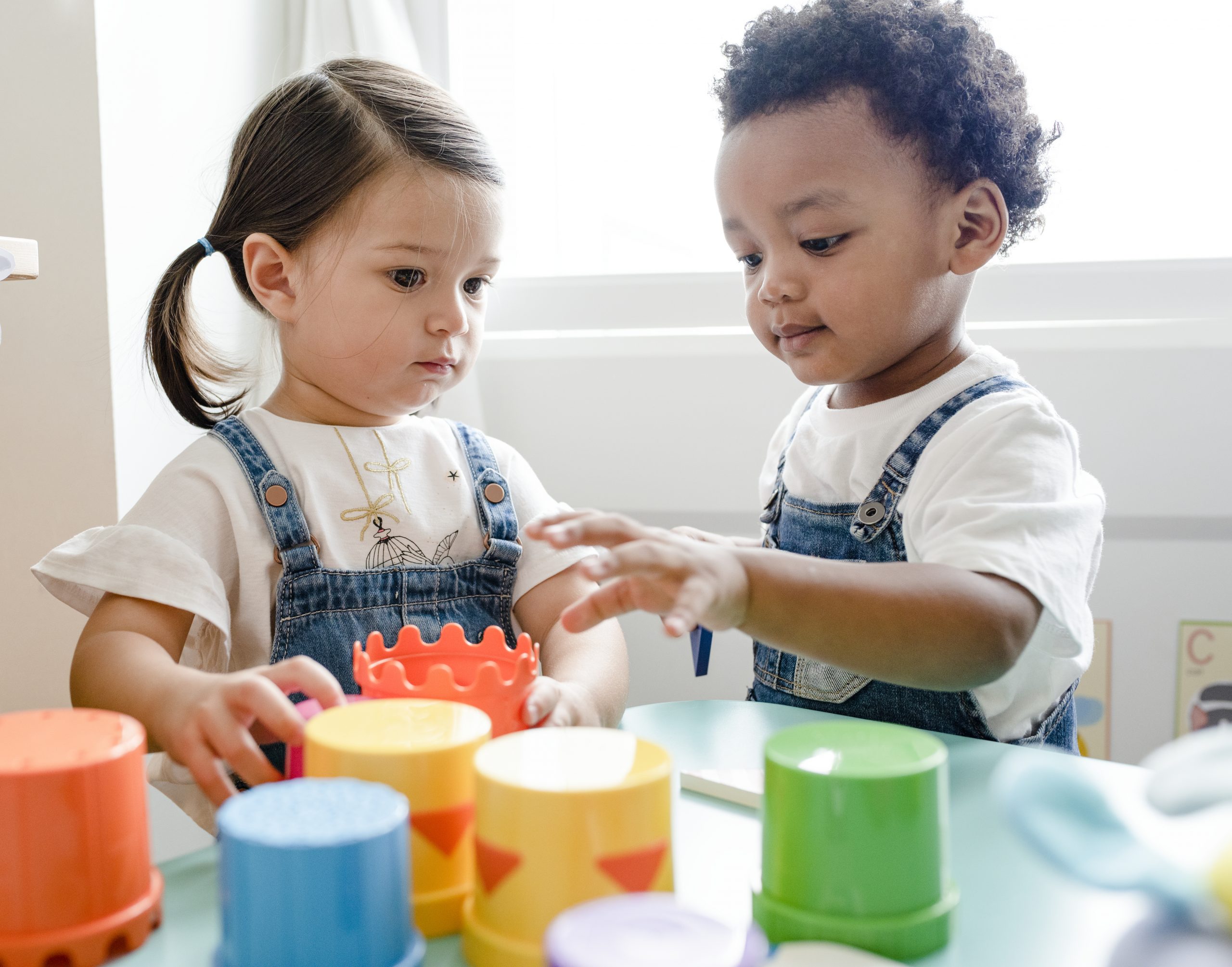 Little kids playing toys at learning center